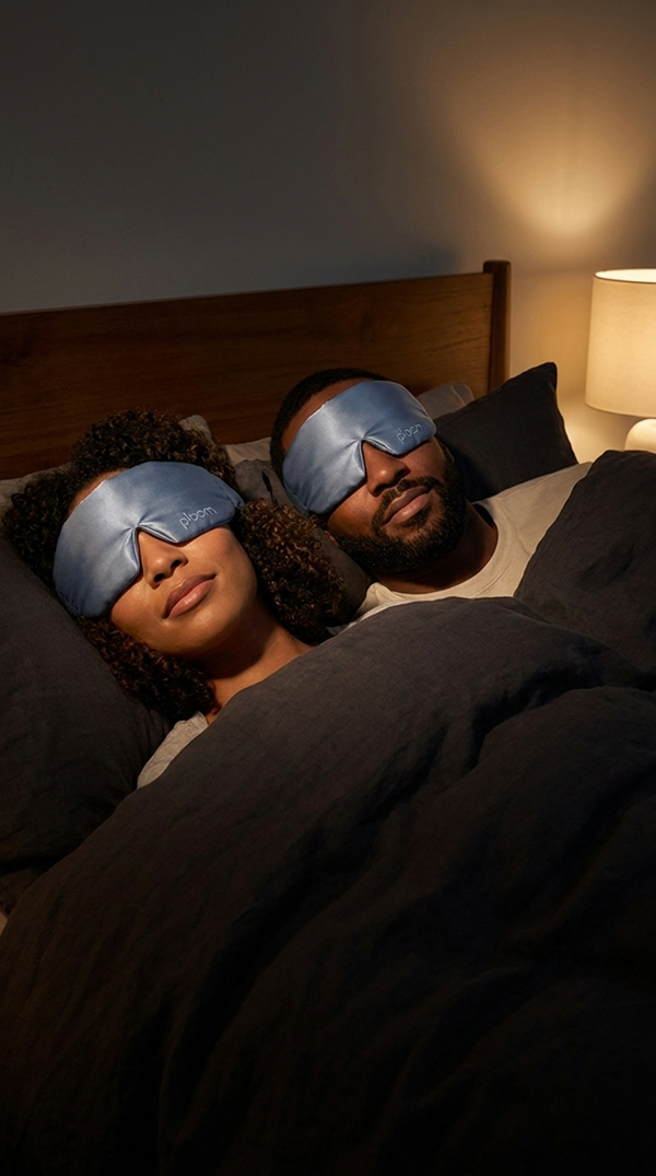 couple wearing ploom masks, lamp still on